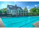 A stunning view of the outdoor pool and clubhouse, creating an inviting atmosphere at 3025 Sunset Pass, Canton, GA 30114