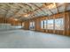 Spacious unfinished basement with exposed wood framing, concrete floor, and natural light at 3025 Sunset Pass, Canton, GA 30114
