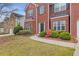 Brick two-story house with a two-car garage and landscaping at 1123 Diamond Xing, Mcdonough, GA 30252