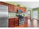 Kitchen with stainless steel appliances and wood cabinets at 1123 Diamond Xing, Mcdonough, GA 30252