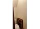 Small bathroom features a toilet and wooden shelving unit for storage at 358 Gold Mine Rd, Dallas, GA 30157