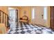 Bright foyer featuring a checkered floor and antique settee at 2073 Castleway Ne Ln, Atlanta, GA 30345