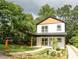 Two-story house with white siding, light brown accents, and a covered porch at 986 Linam Se Ave, Atlanta, GA 30315