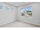 Bright bedroom with three windows offering neighborhood views and neutral carpeting at 128 Laurel Farms Ln, Dallas, GA 30157