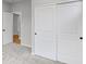 Spacious closet with sliding doors and an open doorway to the bedroom at 128 Laurel Farms Ln, Dallas, GA 30157