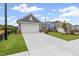 Desirable new home featuring gray siding, a manicured lawn, and a two-car garage at 128 Laurel Farms Ln, Dallas, GA 30157