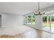 Bright living room featuring large windows and a sliding glass door at 128 Laurel Farms Ln, Dallas, GA 30157