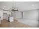Open floorplan featuring modern kitchen with island and adjoining living room at 128 Laurel Farms Ln, Dallas, GA 30157