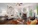 Bright living room with fireplace, large artwork, and hardwood floors at 111 Mount Vernon Dr, Decatur, GA 30030