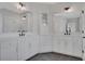 Bright bathroom with double vanity, modern fixtures, and white cabinets at 6670 Benchwood Path, Cumming, GA 30028