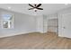 Bright and airy bedroom with hardwood floors, neutral walls, and modern ceiling fan at 6670 Benchwood Path, Cumming, GA 30028