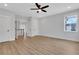 Bright and airy bedroom with hardwood floors, neutral walls, and modern ceiling fan at 6670 Benchwood Path, Cumming, GA 30028