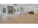 Spacious living room with stone fireplace, abundant natural light, and open access to the kitchen at 6670 Benchwood Path, Cumming, GA 30028