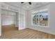 Bright office with hardwood floors, large window, and glass door entry to an adjacent room at 6670 Benchwood Path, Cumming, GA 30028
