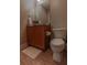 Bathroom includes a toilet, vanity with storage and a decorative mirror at 171 Auburn Ave # 329, Atlanta, GA 30303