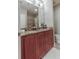 Bathroom features a double vanity with dark wood cabinets and a large mirror at 171 Auburn Ave # 329, Atlanta, GA 30303