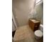 Powder room with a granite countertop vanity and tile flooring at 171 Auburn Ave # 329, Atlanta, GA 30303