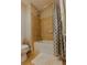 Bathroom featuring tub and shower combination, tiled wall, and shower curtain at 171 Auburn Ave # 329, Atlanta, GA 30303