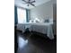 Bright bedroom featuring hardwood floors, two beds, ceiling fan and sunlit window at 171 Auburn Ave # 329, Atlanta, GA 30303