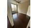 Bright bedroom featuring hardwood floors, a ceiling fan, and a large window with city views at 171 Auburn Ave # 329, Atlanta, GA 30303
