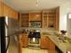 Well-equipped kitchen with stainless steel appliances, granite countertops and wood cabinets at 171 Auburn Ave # 329, Atlanta, GA 30303
