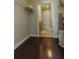 Well-maintained laundry area with shelving, an open door into the washroom and dark wood floors at 171 Auburn Ave # 329, Atlanta, GA 30303
