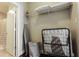 Efficient laundry closet with ironing board, storage shelf and laundry basket at 171 Auburn Ave # 329, Atlanta, GA 30303