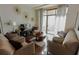 Comfortable living room with hardwood floors, modern decor and natural light from sliding glass doors at 171 Auburn Ave # 329, Atlanta, GA 30303