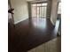 Living room featuring dark wood floors, natural light, and open entryways at 171 Auburn Ave # 329, Atlanta, GA 30303
