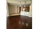 Living space with hardwood flooring and a view into the kitchen with a breakfast bar at 171 Auburn Ave # 329, Atlanta, GA 30303
