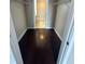 Spacious walk-in closet with dark hardwood floors and built-in shelving at 171 Auburn Ave # 329, Atlanta, GA 30303