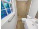 Well-lit bathroom featuring a walk-in shower, modern fixtures, and a view from the window at 3371 Vandiver Dr, Marietta, GA 30066