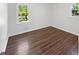 Bright bedroom featuring modern flooring and two windows at 3371 Vandiver Dr, Marietta, GA 30066