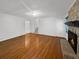 Spacious living room with hardwood floors, a fireplace, and a staircase at 3371 Vandiver Dr, Marietta, GA 30066