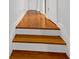 Elegant staircase with hardwood steps and freshly painted white risers at 3371 Vandiver Dr, Marietta, GA 30066