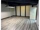 A finished basement area showcasing modern lighting and updated flooring at 5741 Wolf Laurel, Lilburn, GA 30047
