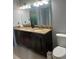Bathroom with a double vanity, granite countertop, and a large mirror at 5741 Wolf Laurel, Lilburn, GA 30047