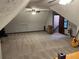 Well-lit bonus room with unique ceiling, ample space, and storage options for flexible living arrangements at 5741 Wolf Laurel, Lilburn, GA 30047
