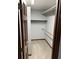 Walk-in closet with carpet flooring and shelving units at 5741 Wolf Laurel, Lilburn, GA 30047