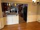 Dining area open to the kitchen with hardwood floors at 5741 Wolf Laurel, Lilburn, GA 30047