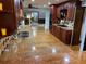 Kitchen with granite countertops, tile backsplash and hardwood floors at 5741 Wolf Laurel, Lilburn, GA 30047