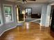 Hardwood floors transition to carpet in sitting area with open doorway at 5741 Wolf Laurel, Lilburn, GA 30047