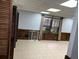 A view of a room with tiled flooring, and wood trimmed window and doors at 5741 Wolf Laurel, Lilburn, GA 30047