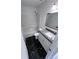Neat bathroom with tub, shower, granite vanity, and black marble floors at 5947 Rock Rd, Union City, GA 30291