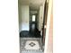 Entryway showcases a decorative floor tile design and a hallway with unique marble flooring at 5947 Rock Rd, Union City, GA 30291