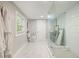 Bright bathroom featuring a glass shower, white tile, and a gray color scheme at 7 Yachting Way, Acworth, GA 30102