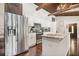 Modern kitchen with stainless steel appliances, island, and granite countertops at 7 Yachting Way, Acworth, GA 30102