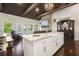 Open-concept living area with island, fireplace, and scenic lake views at 7 Yachting Way, Acworth, GA 30102