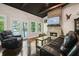 Spacious living room with stone fireplace, wood floors, and lake views from the double doors at 7 Yachting Way, Acworth, GA 30102