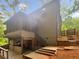 Back exterior view of home with porch, patio and stairs to fenced in backyard at 2864 Sudbury Ct, Marietta, GA 30062